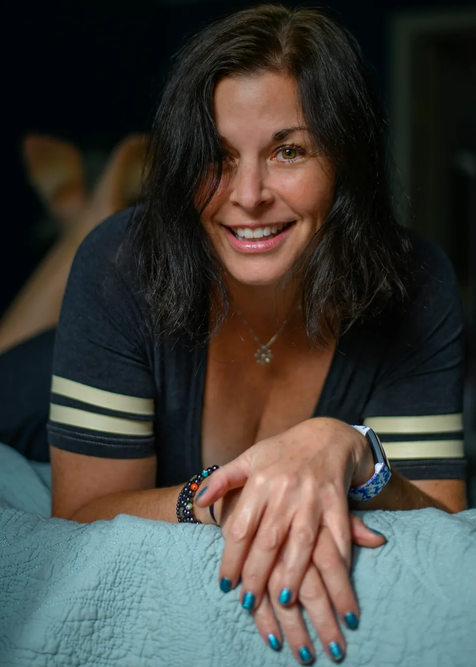 Smiling portrait of a woman on top striped