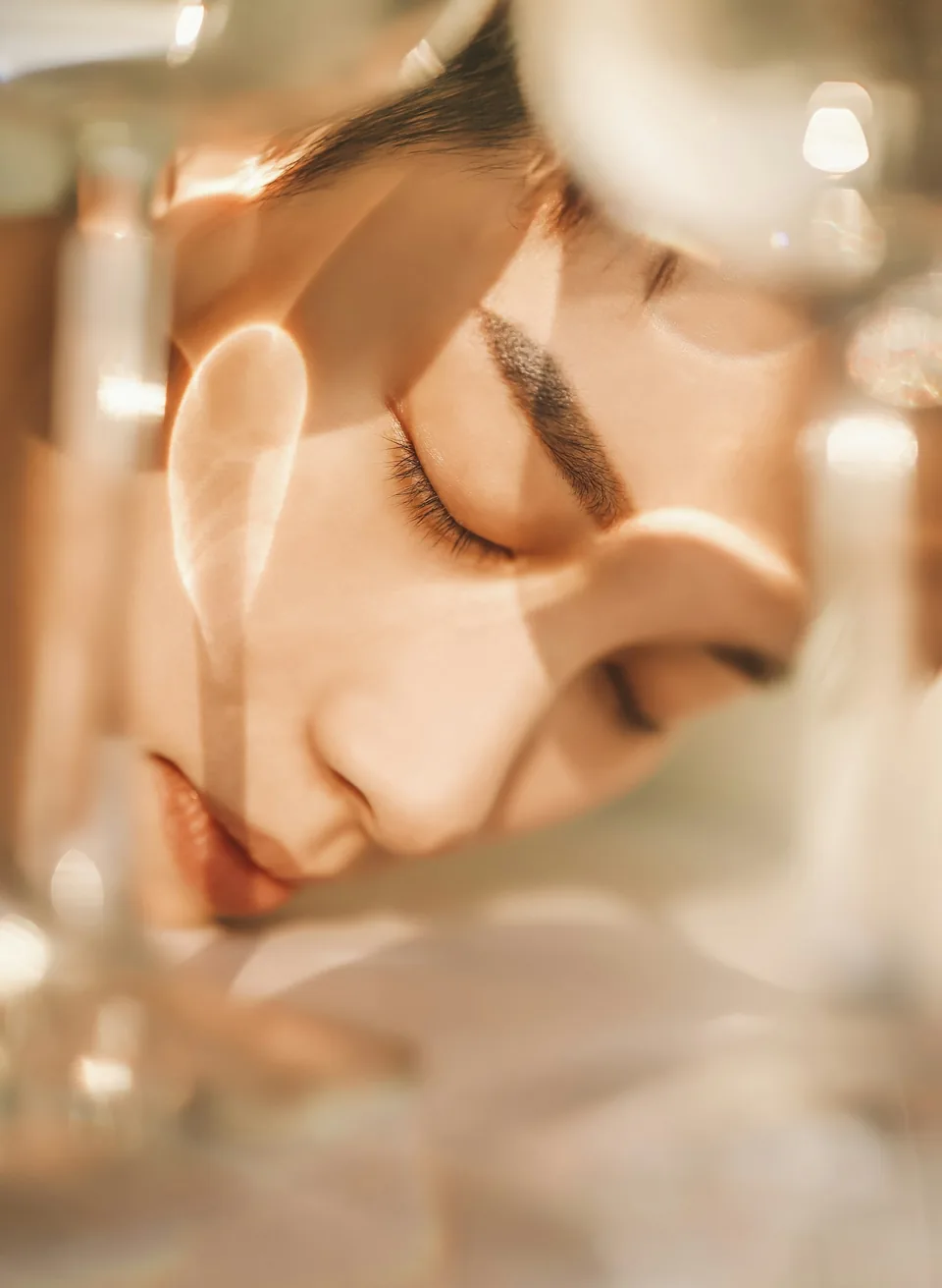 woman portrait with closed eyes through glass